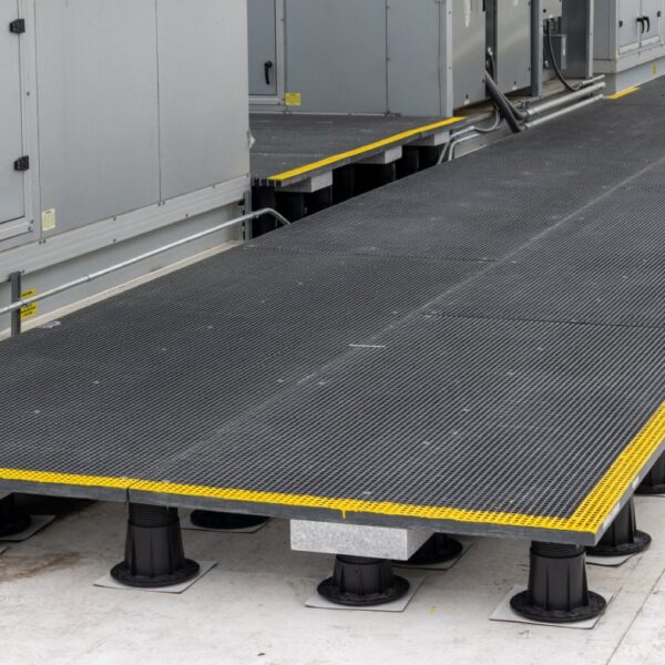 Long view of rooftop access system spanning multiple equipment banks with step transitions