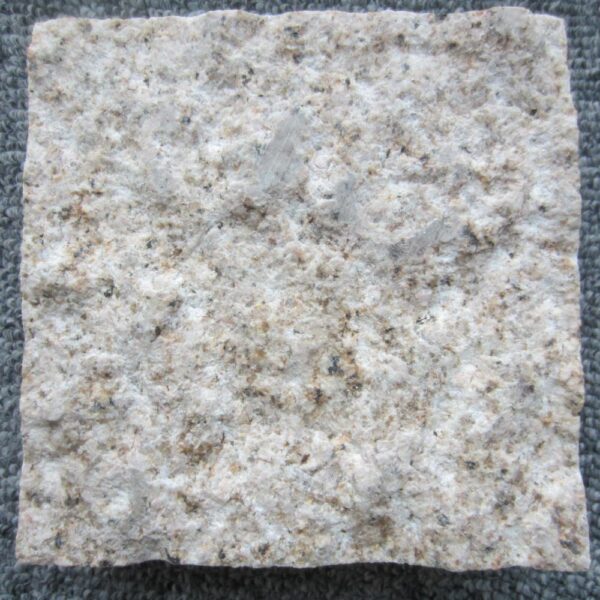 Pepper Tan granite with pineapple stone finish displays a consistent, textured surface.