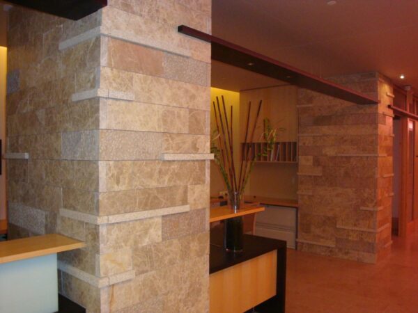 Hospital imaging lobby with natural stone and wood.