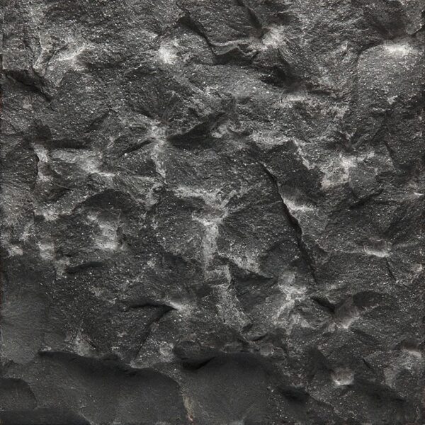 Black Jade limestone with pineapple stone finish showing a dark, textured surface with raised geometric pattern.