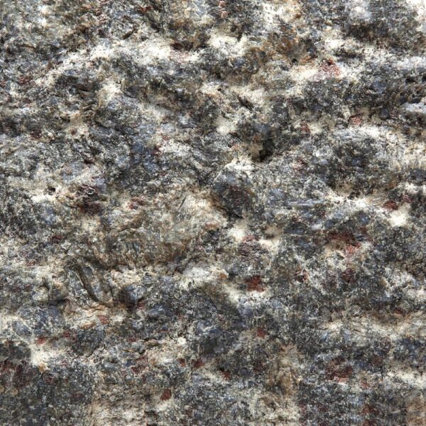 Butterfly Blue basalt with pineapple stone finish showing a dark, rugged surface with raised geometric texture.