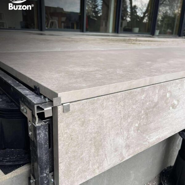 Close-up of PB-End finishing kit with E-BRS rails and stair tread spacing detail