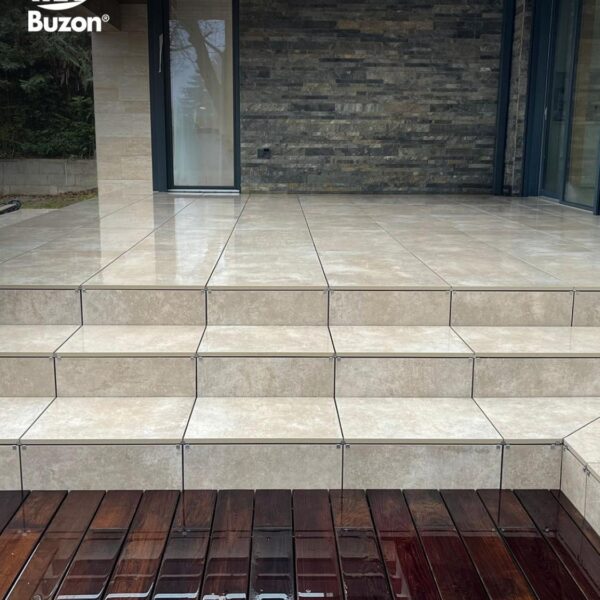 Completed porcelain staircase connecting to raised deck with mixed decking materials