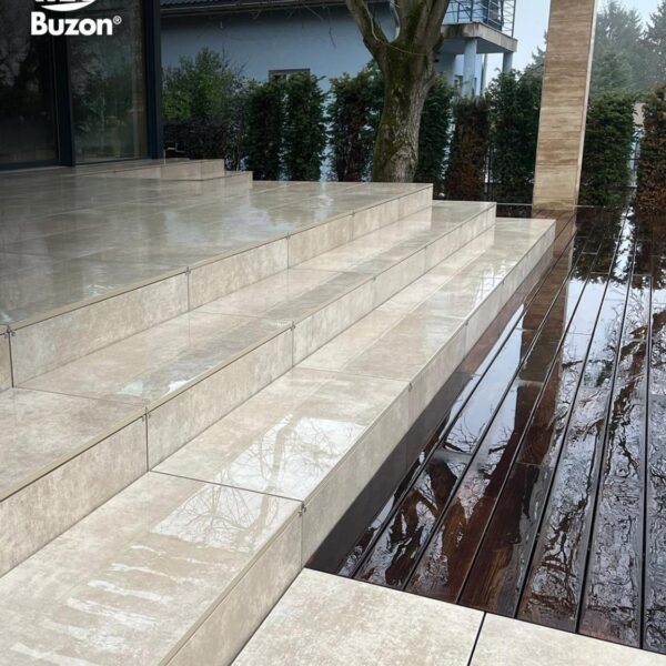 Completed terrace with reflective porcelain surface after rain showing water drainage performance