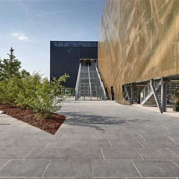 Commercial public plaza with HDG Colo-Grigi porcelain pavers designed for heavy pedestrian and vehicular use.