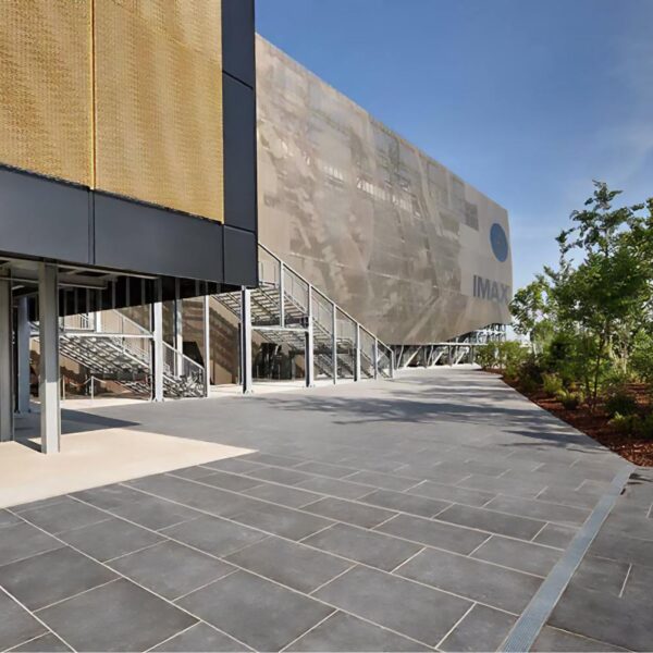 Pedestrian walkway at an IMAX theatre plaza entrance paved with HDG Colo-Grigi porcelain pavers.