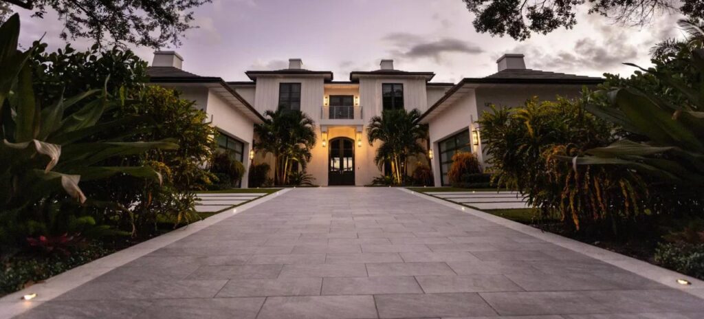 Grand approach and entrance to villa with parking lot porcelain pavers.