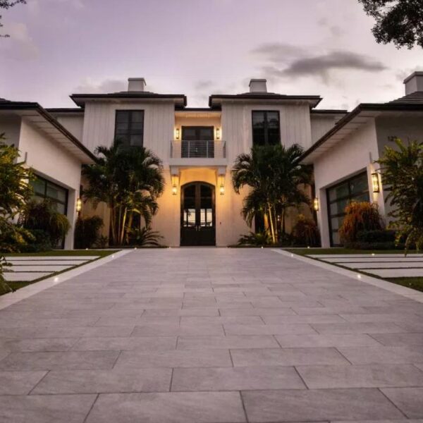 Grand approach and entrance to villa with parking lot porcelain pavers.