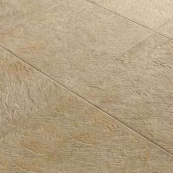 Close-up of 24x24 Rosca Gold porcelain pavers showing surface texture and installed finish.