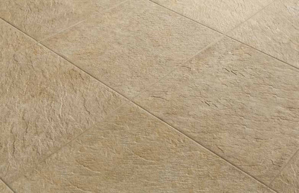 Close-up of 24x24 Rosca Gold porcelain pavers showing surface texture and installed finish.