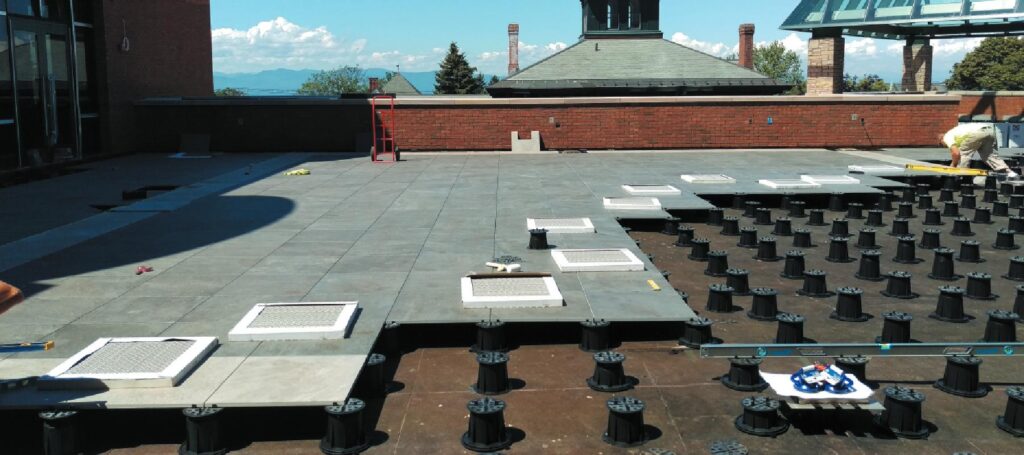 Rooftop deck system at Champlain College with Buzon pedestals and porcelain pavers.